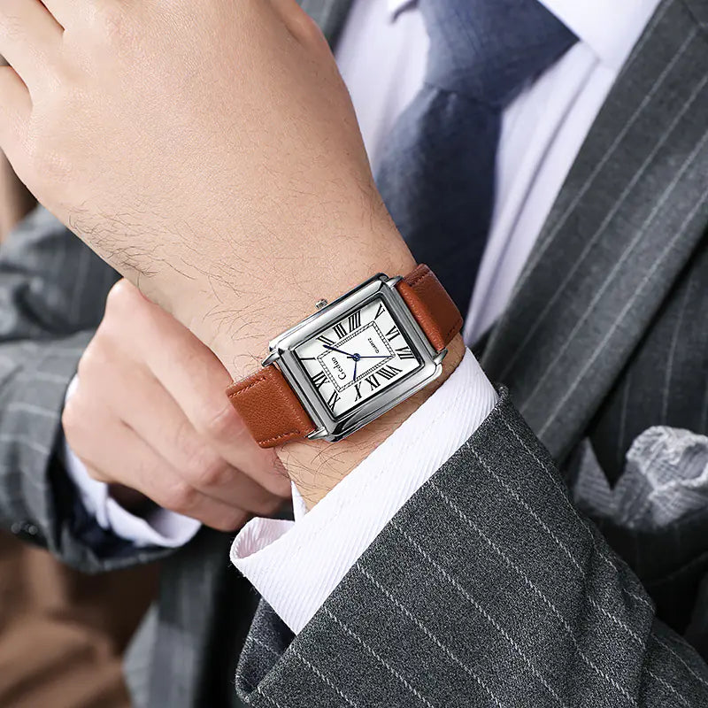 Elegant men's accessories: Classic square business watch with silver-tone casing and dark leather strap.