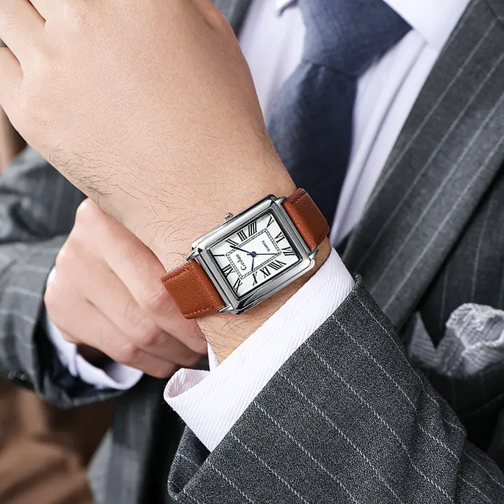 Elegant men's accessories: Classic square business watch with silver-tone casing and dark leather strap.