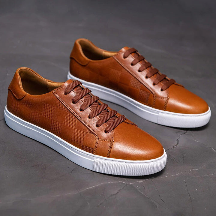 Close-up of the sole of men's leather low-top sneakers, showing durable rubber for excellent grip