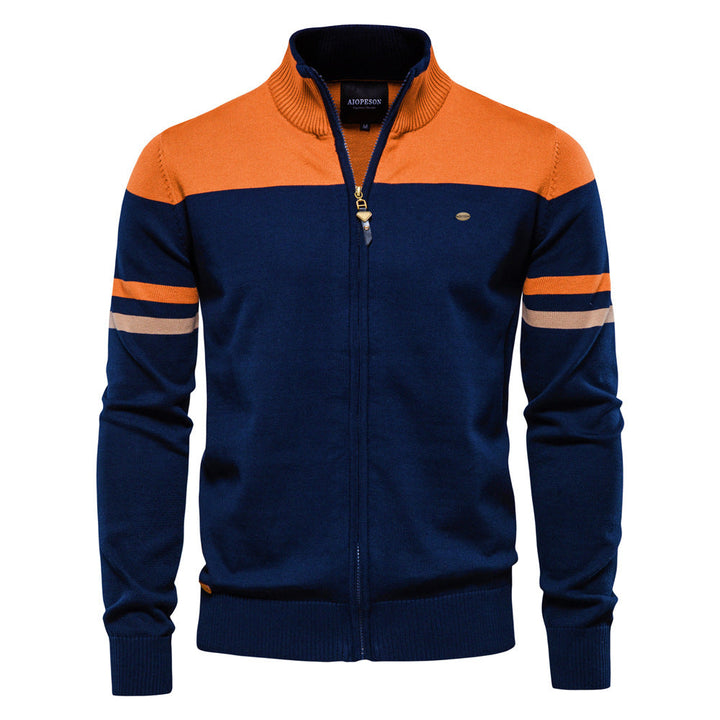 Detail of the zipper closure on a men's colorblock cardigan sweater, quality outerwear.