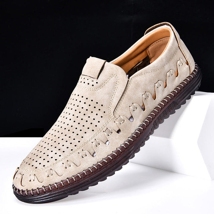 Close-up of men's cowhide leather loafers, showcasing moc-toe stitching and texture.