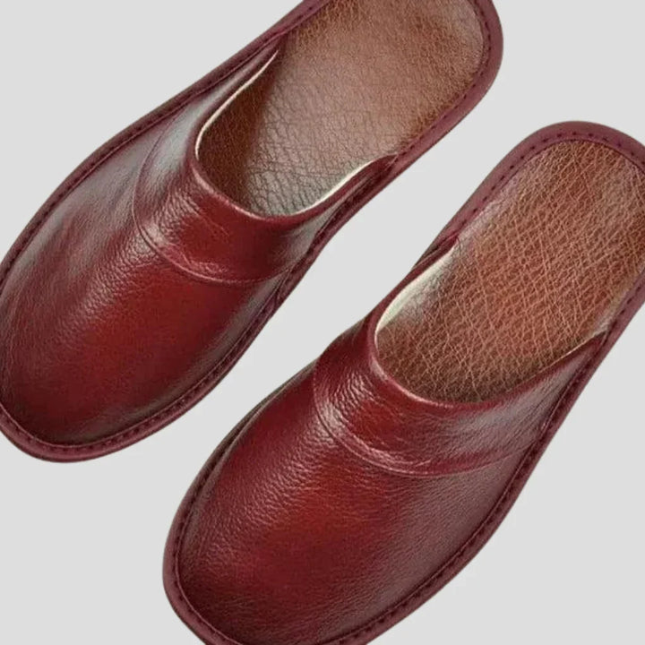 Men's comfortable, slip-on indoor house shoes with a padded insole, perfect for cozy relaxation at home.