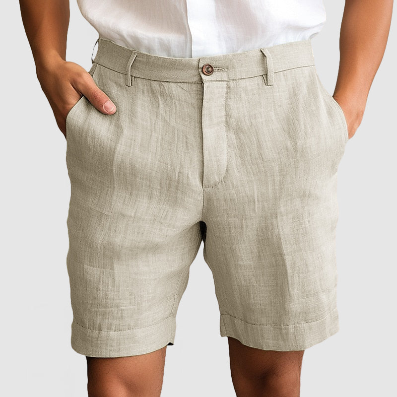 Tailored men's chino shorts with cuffed hem & flat front for a modern, versatile smart casual look.