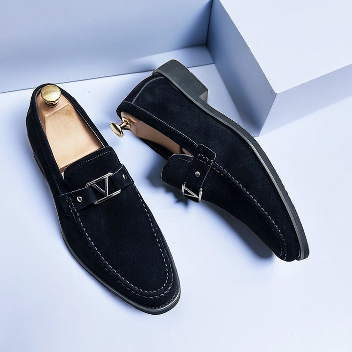 Men's elegant slip-on loafers, offering versatile comfort for formal wear or smart casual spring/summer style.
