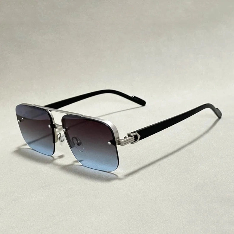 Close-up of frameless square men's sunglasses, highlighting the sleek metal details and gradient UV400 lenses.