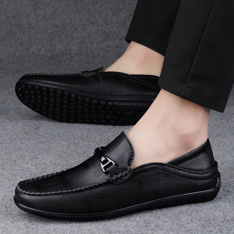 Side view of black genuine leather slip-on loafers, showcasing sleek design and craftsmanship