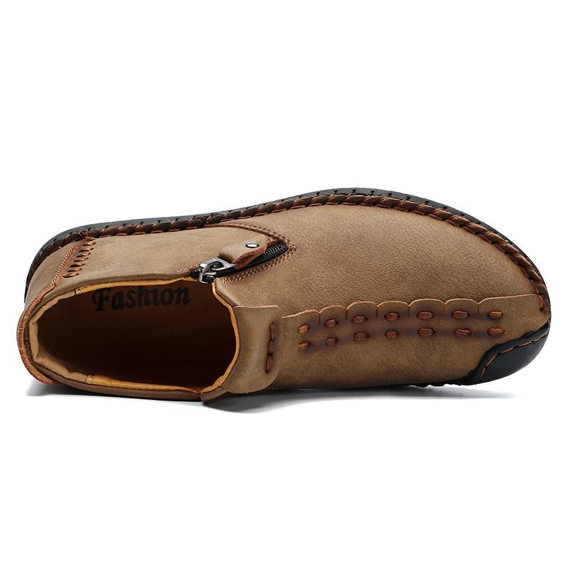 Top-down view of men's comfortable hand-stitched leather ankle boots, casual wear