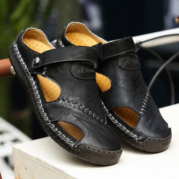 Close-up of the secure closed-toe feature of men's genuine leather outdoor sandals.