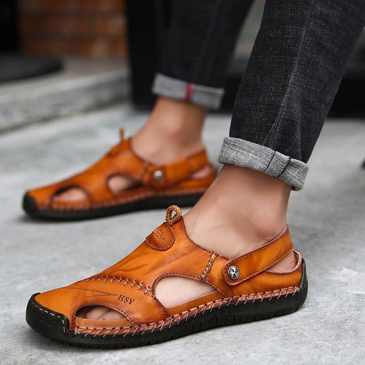 Front view of men's hand-stitched closed-toe leather sandals, robust summer footwear.
