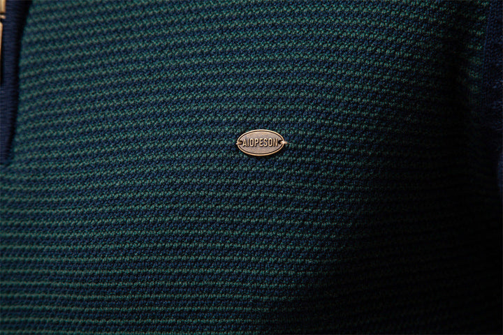 Angled view of men's maroon half-zip sweater, durable cotton blend knit for men