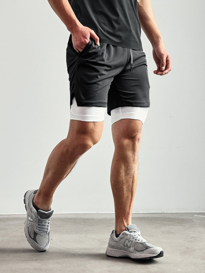 Men's activewear shorts, Kinetic Mesh Lined, in a forest green color for outdoor activities