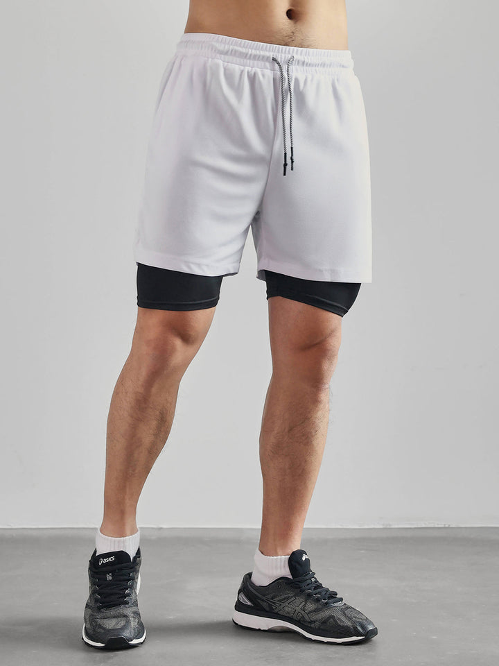 Men's Kinetic Mesh Lined Shorts with an embroidered logo, representing quality activewear