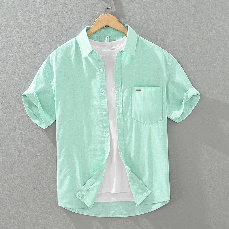 Relaxed fit men's summer shirt, made from a breathable cotton blend, with a functional chest pocket detail.