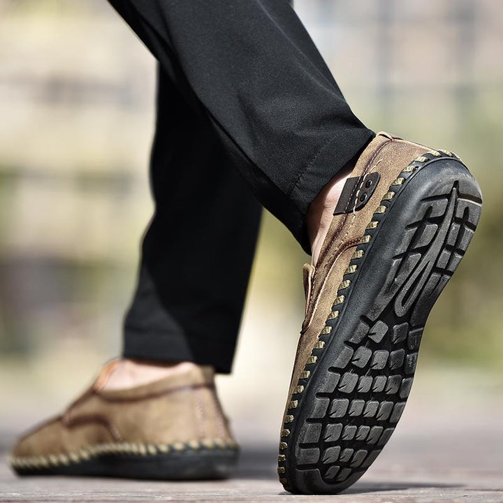 Top view of men's black leather business casual shoes, highlighting the round toe shape