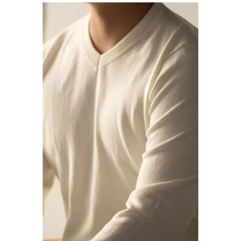 Men's luxury cashmere-blend V-neck sweater in a sophisticated cream, perfect for elegant winter fashion.