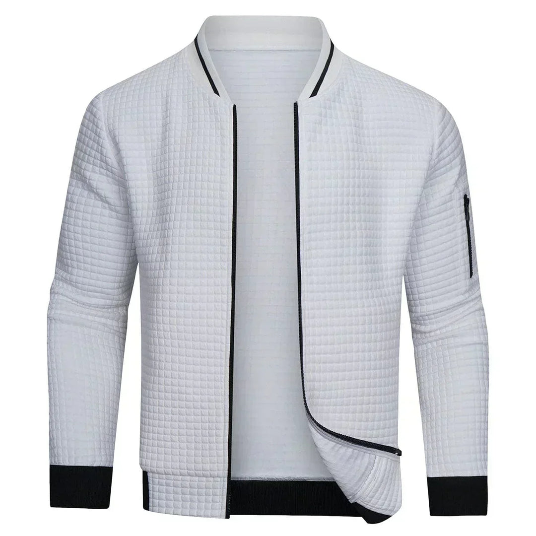 Man wearing a men's full-zip textured grid cardigan. Perfect for effortless layering, casual or smart-casual occasions.