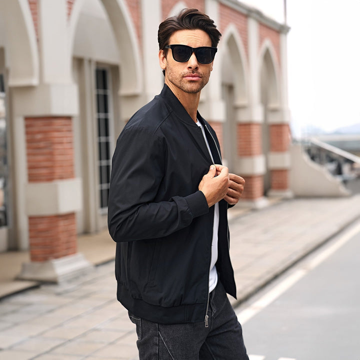 Model walking in a men's bomber jacket, dynamic shot, capturing casual movement and style