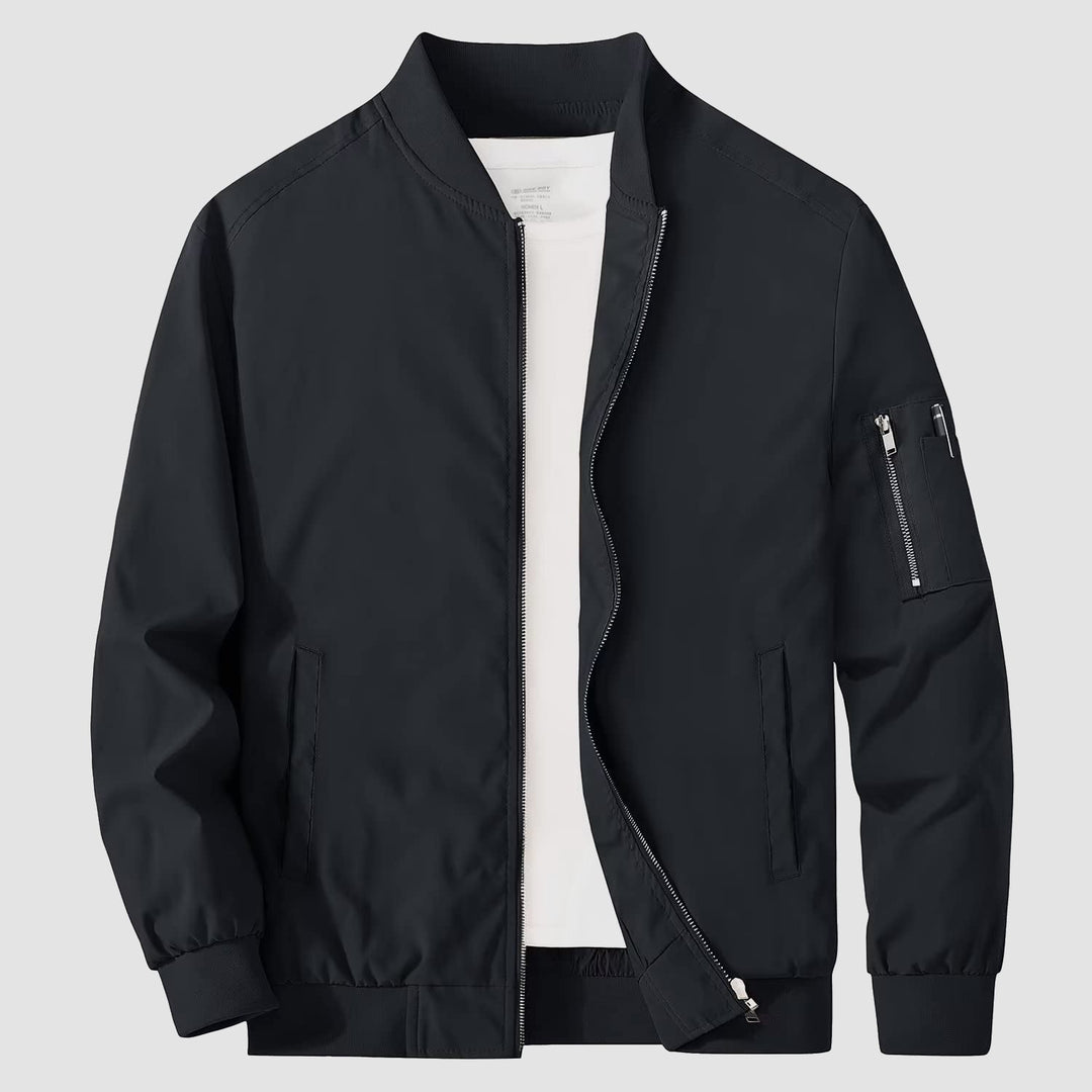 Side profile of a man wearing a bomber jacket, casual outerwear, stylish modern look