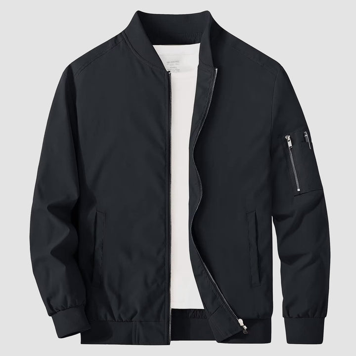Side profile of a man wearing a bomber jacket, casual outerwear, stylish modern look
