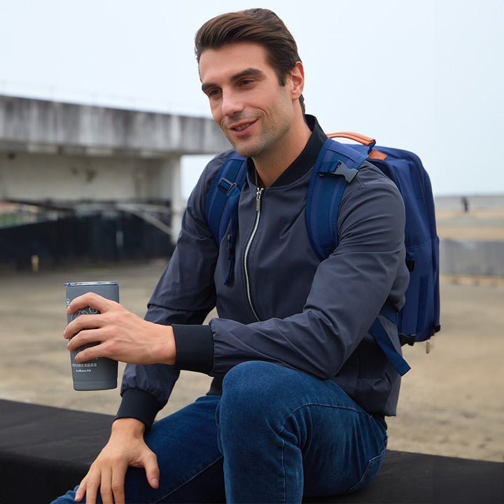 Men's lightweight bomber jacket modeled with a t-shirt, highlighting its layering potential