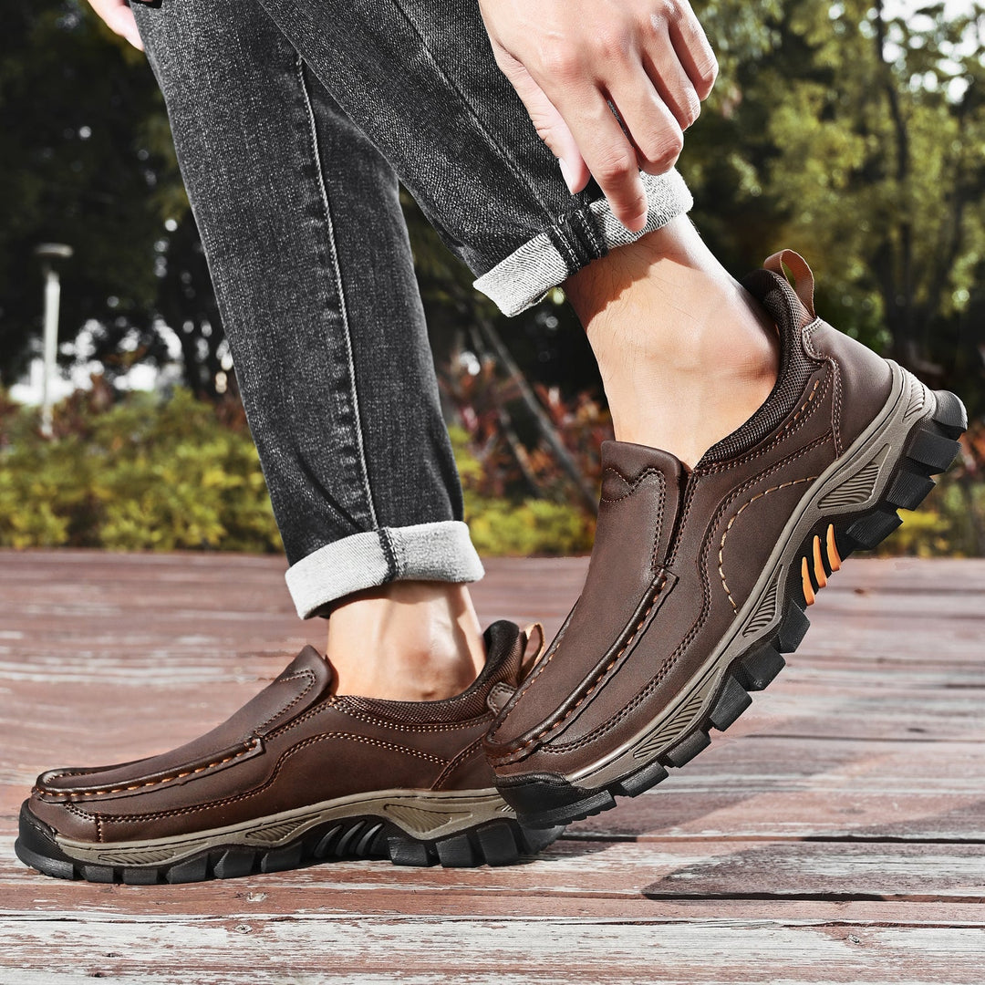 Men's casual leather slip-on walking shoes in a natural outdoor setting
