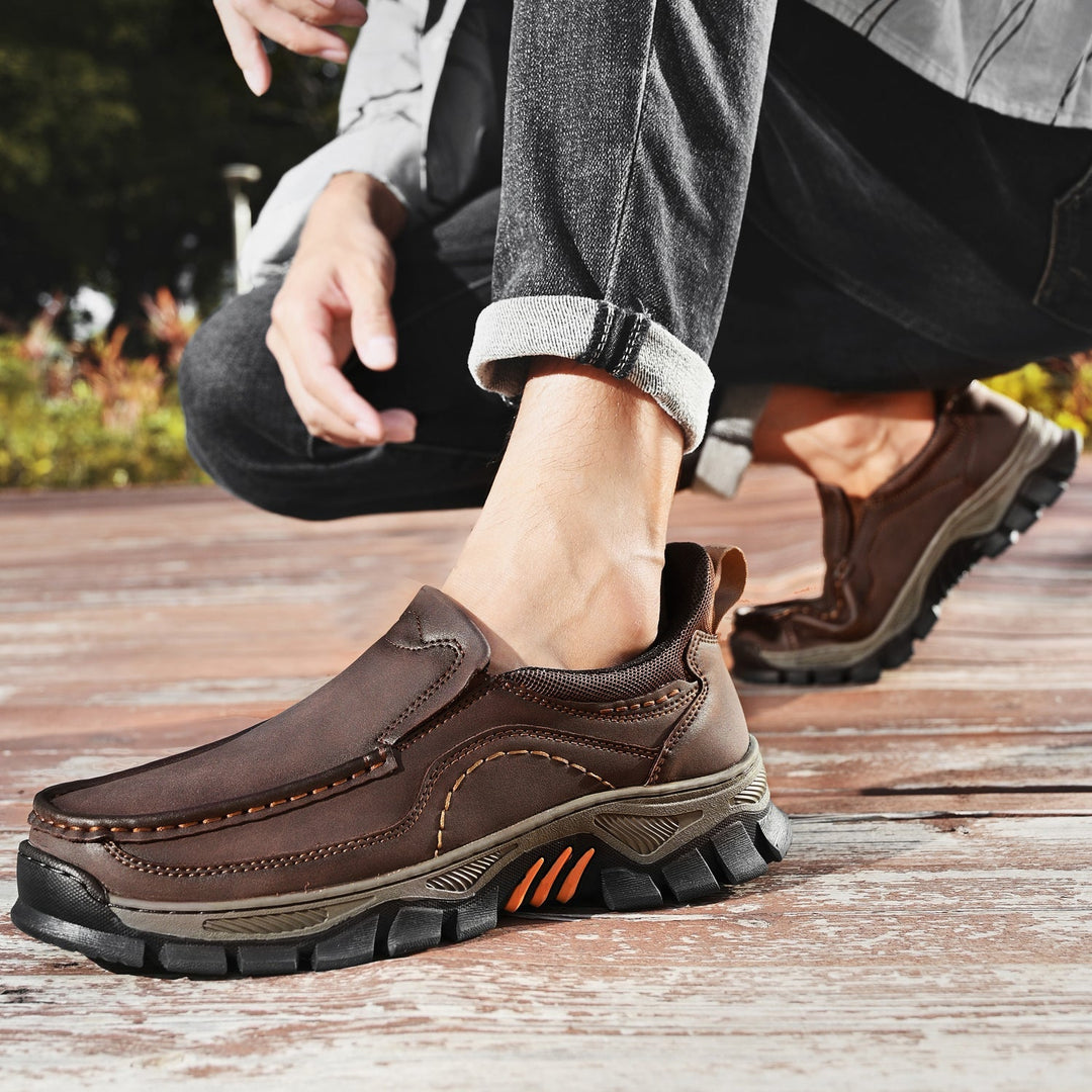 Close-up of stitching on men's orthopedic slip-on leather walking shoes