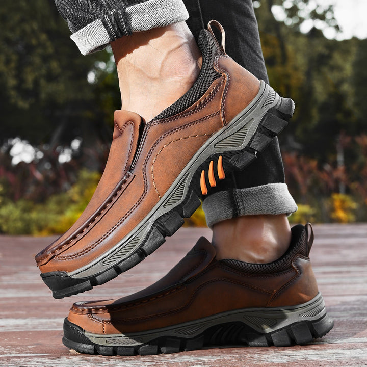 A man wearing orthopedic casual slip-on leather walking shoes, walking outdoors