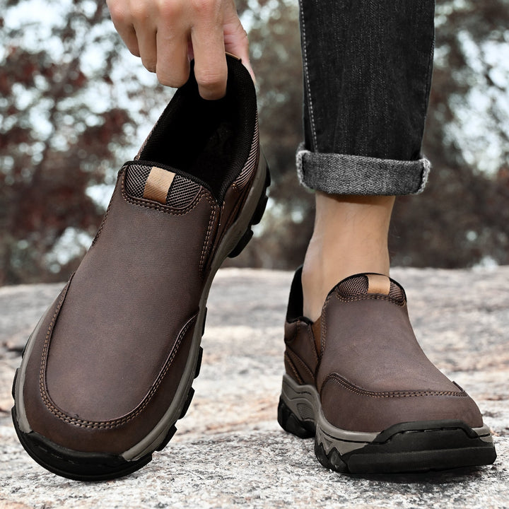 Detailed view of the stitching on men's leather slip-on walking shoes