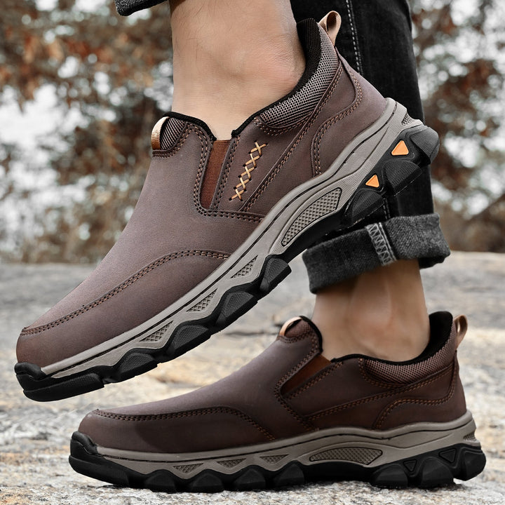 Back view of men's orthopedic leather slip-on shoes, emphasizing heel support