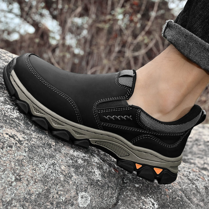 A single men's orthopedic slip-on walking shoe, highlighting its features