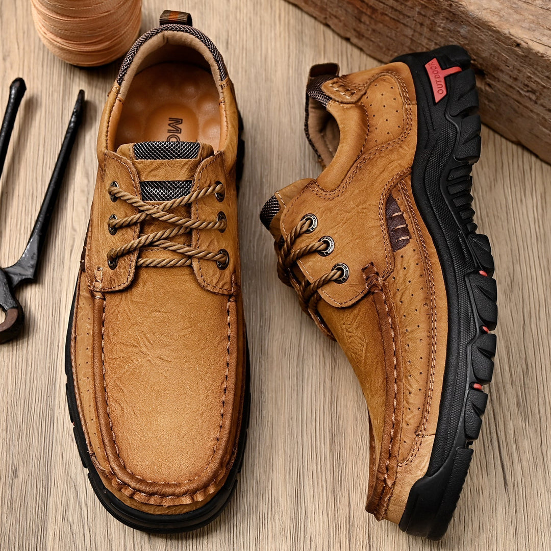 Brown leather men's orthopedic boots with strong laces, offering superior comfort and support