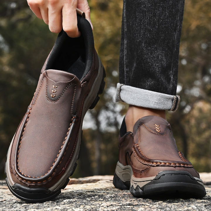 Outdoor shot of men's casual orthopedic leather slip-on walking shoes on a path