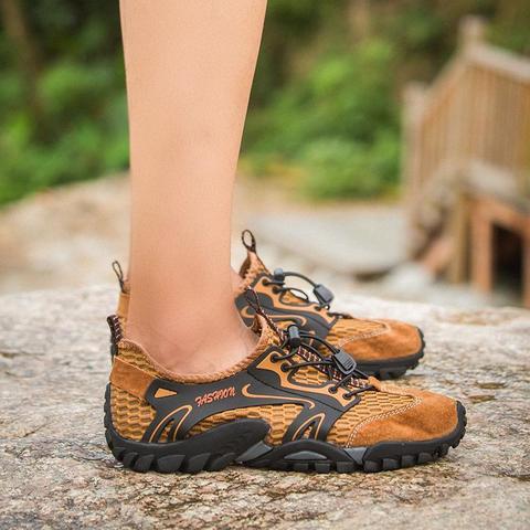 Top-down view of men's trail running shoes, showcasing the lacing system and secure fit