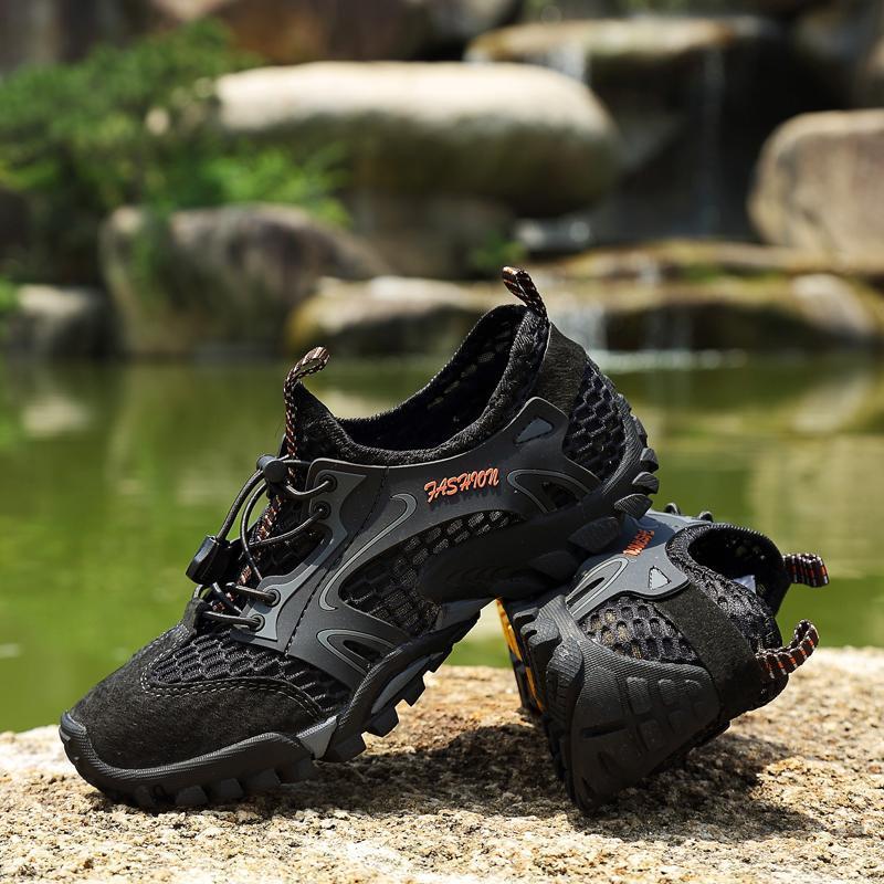 Close-up of men's waterproof & breathable hiking trail shoes, showcasing durable outsoles