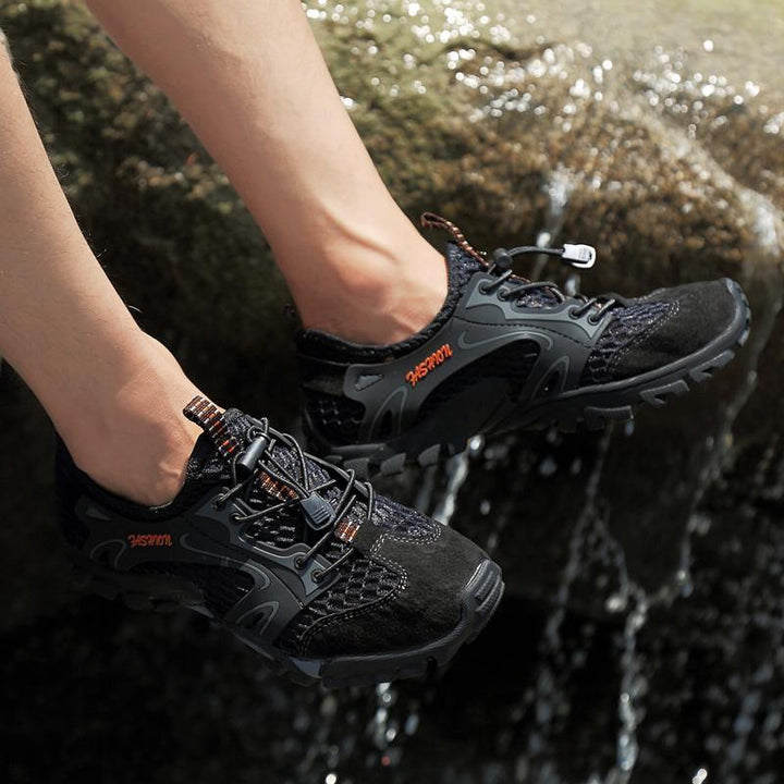Pair of men's lightweight all-season trail running shoes in a dynamic, action-oriented shot