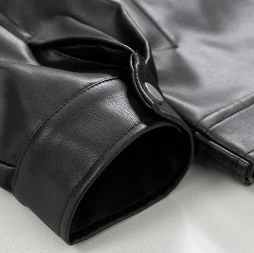 Men's fashionable black leather oversized bomber jacket, showcasing modern streetwear style.