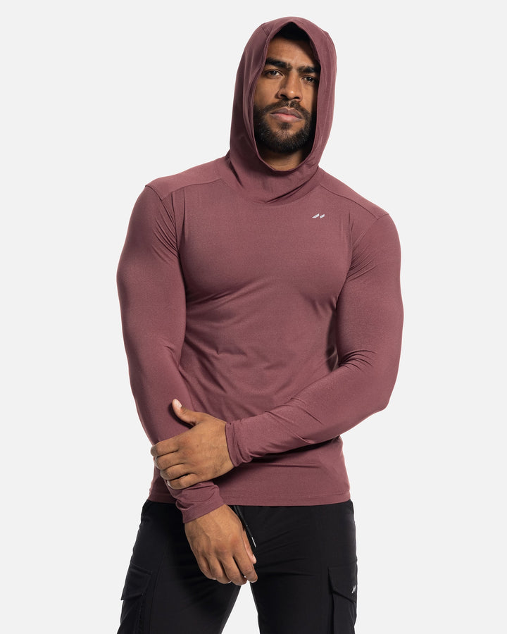 Close-up of breathable fabric texture on a men's performance baselayer hoodie