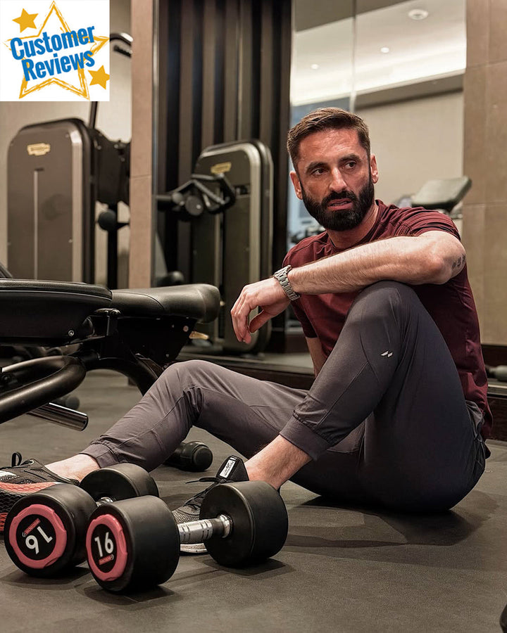 Textured fabric of men's stretch performance joggers, modern fit in black.