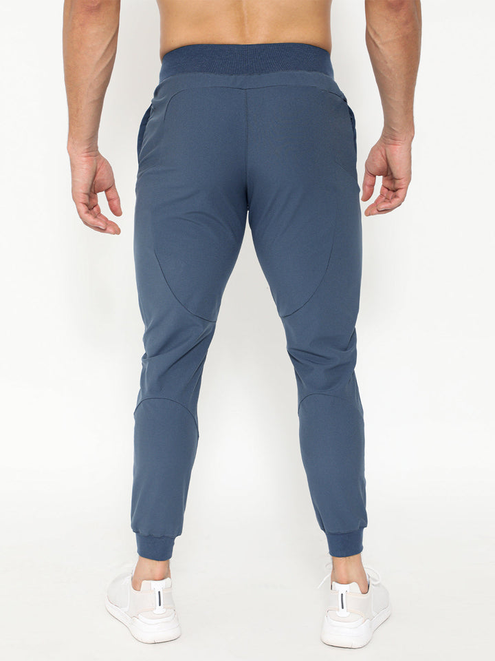 Back view of men's athletic joggers, highlighting comfortable fit and quality stitching, perfect for running.