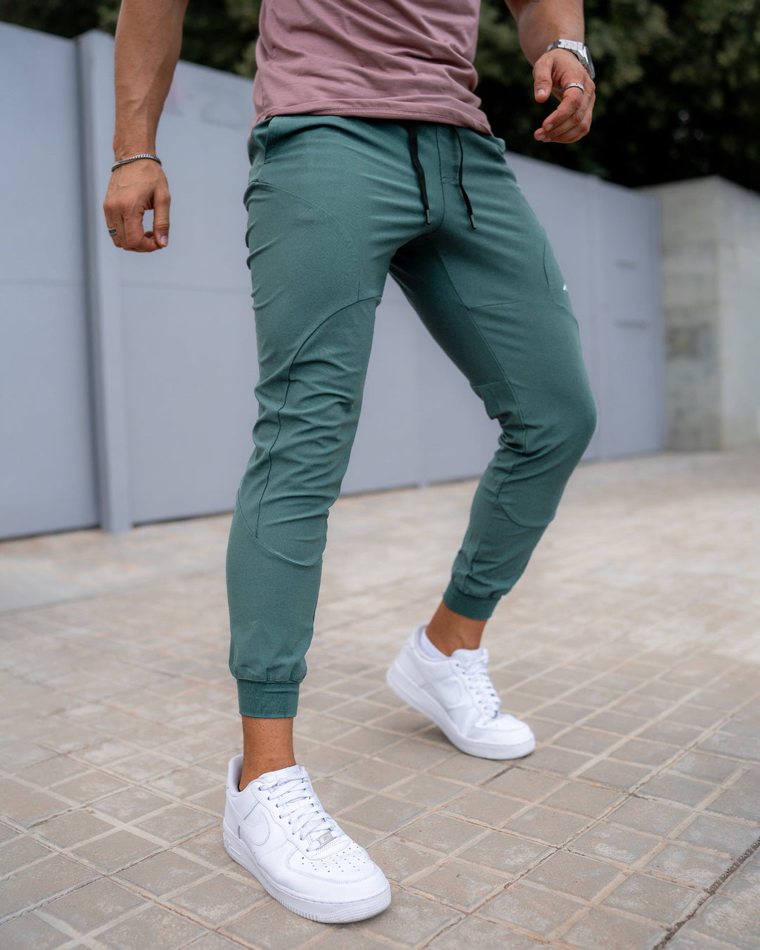 Detailed shot of men's jogger pockets, secure and deep enough for essentials, quick-dry material.