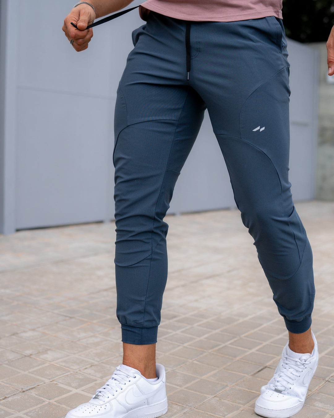 Men's essential active joggers, fundamental for any workout wardrobe, quick-dry, stretch, and tapered fit.