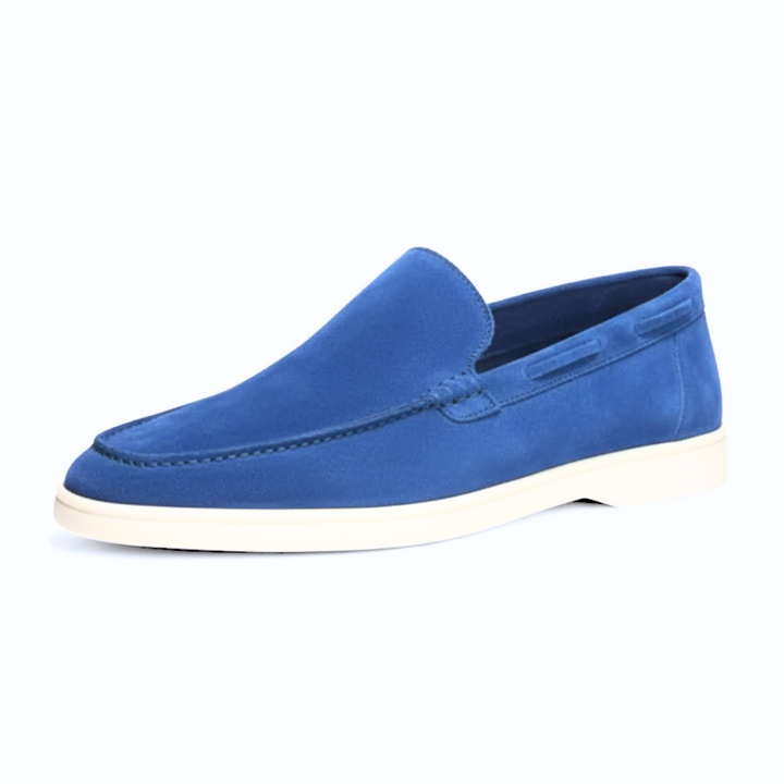 Detail shot of the craftsmanship on men's premium suede slip-on loafers, emphasizing quality and comfort.