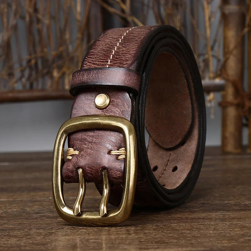 Stylish men's black cowhide leather belt with a polished brass buckle, a versatile accessory