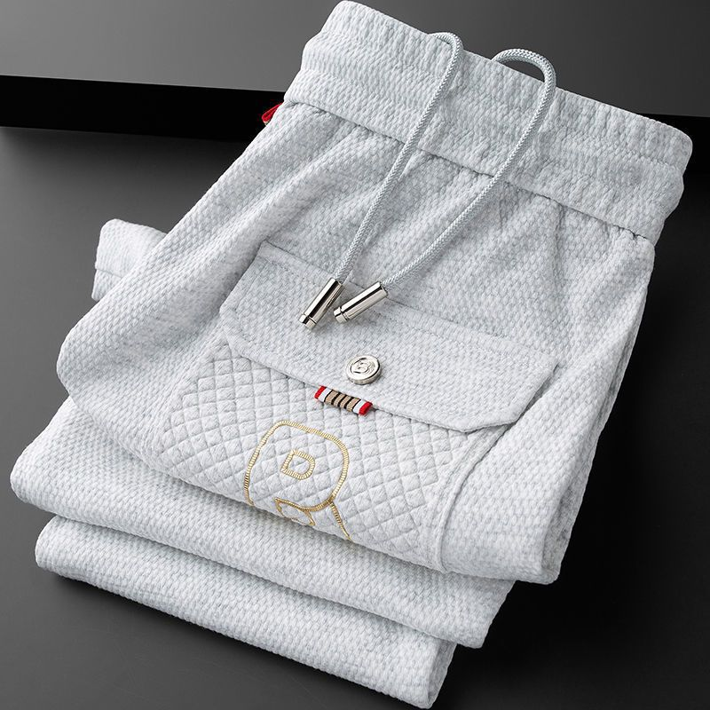 Tapered athletic joggers for men, black, featuring a comfortable drawstring waist.