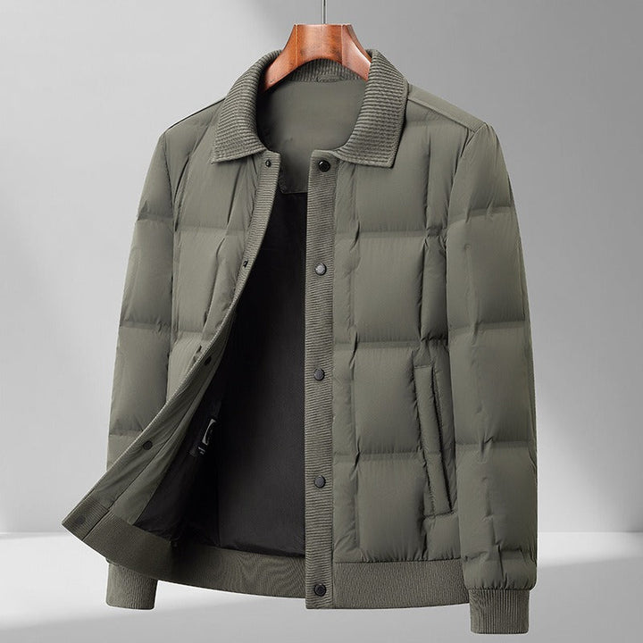 Close-up of quilted pattern on men's relaxed fit puffer jacket with snap closure details