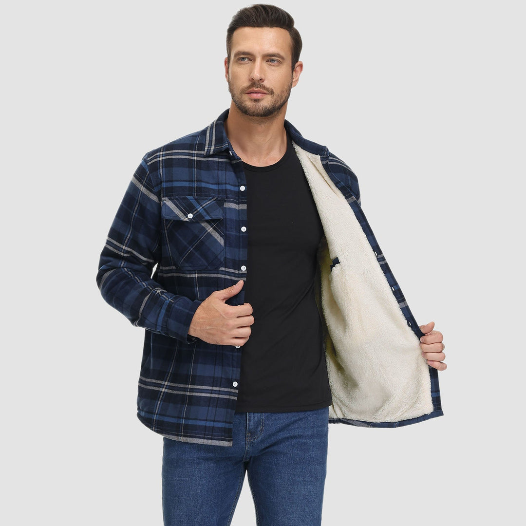 Black and white styled photo of a men's flannel button-down fleece lined jacket, emphasizing its classic cut