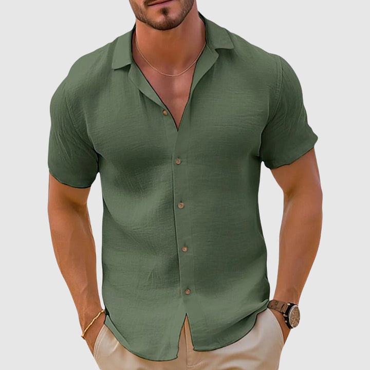Men's relaxed fit short sleeve button-up shirt, great for summer days, comfortable casual warm weather wear.