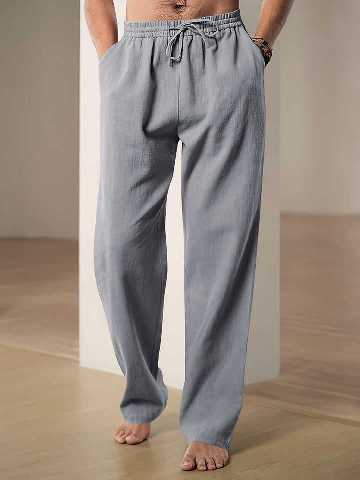 Stylish men's relaxed fit drawstring pants, ideal for modern casual fashion and comfortable loungewear.
