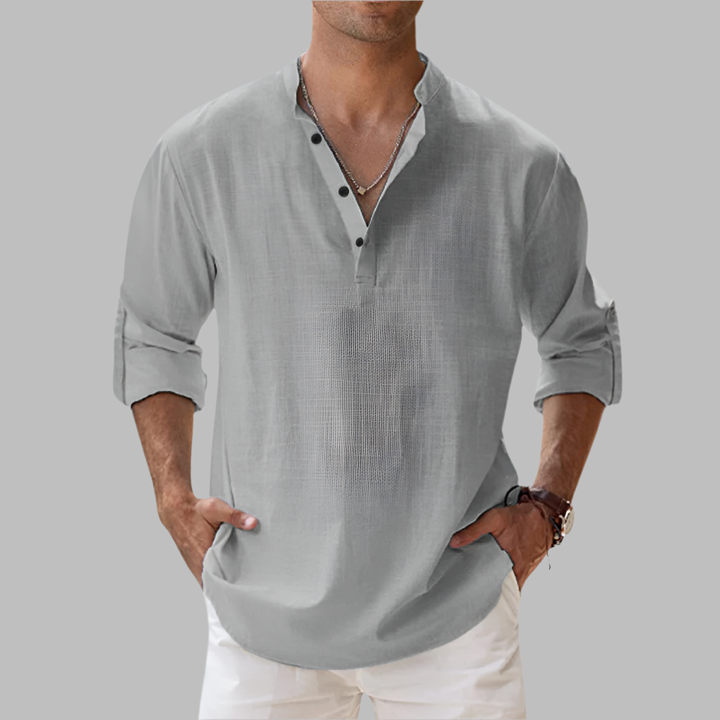 Collared men's button-down shirt with a relaxed fit. Stylish long sleeve design for summer casual fashion.