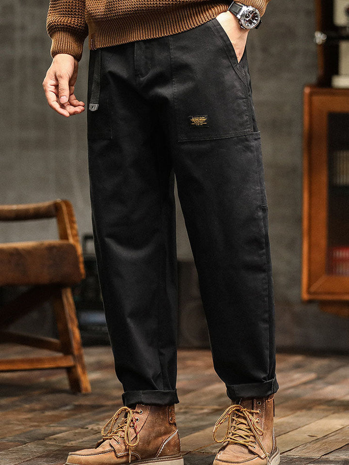 Black men's relaxed fit utility pants, a stylish & comfortable choice for casual outfits.